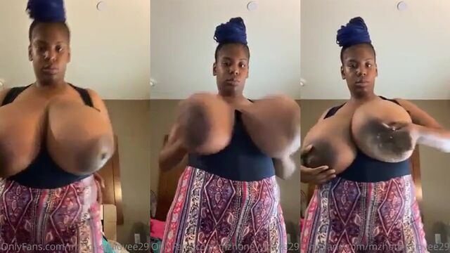 Ebony lactating woman gets her huge tits bounced and played with