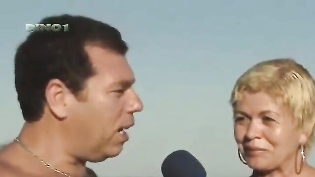 Fit and sexy Sabrina gives an interview on the beach in bikini