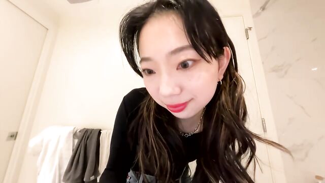 Cute petite Asian girl gives a full striptease