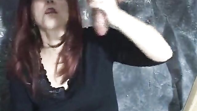 Mz Laney milks cock at the milking table