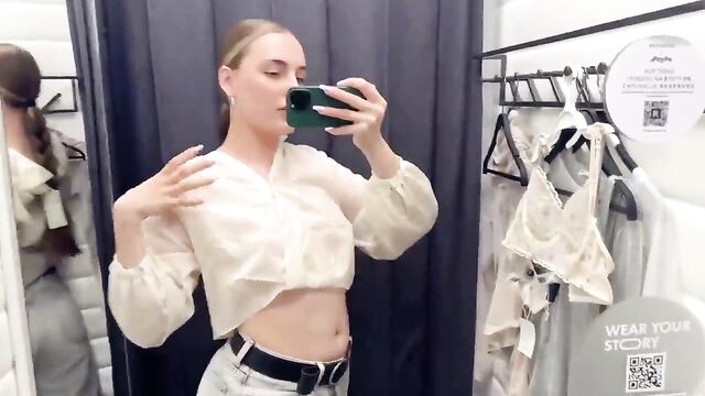Trying on a see-through dress during a haul on YouTube