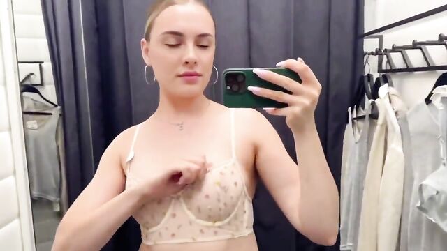 Trying on a see-through dress during a haul on YouTube