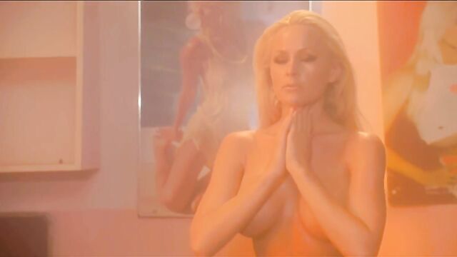 Hot lesbian scene with kissing and topless action in the bathroom
