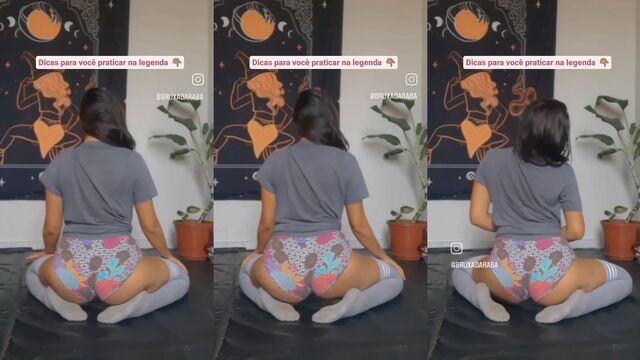 A sexy brunette woman dancing with a tight short skirt and shaking her ass