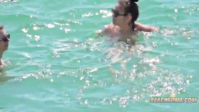 Topless summer model gets naughty on California beach in erotic tease video