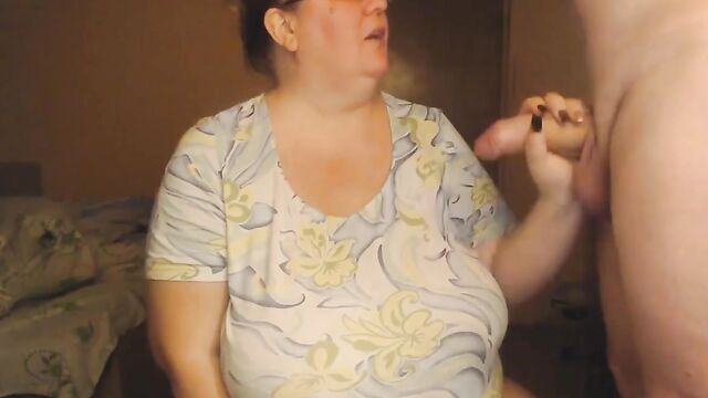 Blonde webcam model shows her huge natural tits while stripping on cam