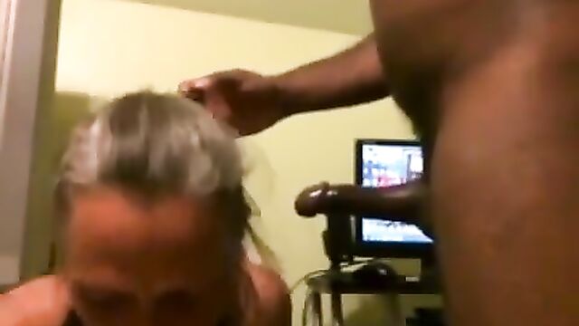 Hot granny gives a deepthroat blowjob to her man’s cock