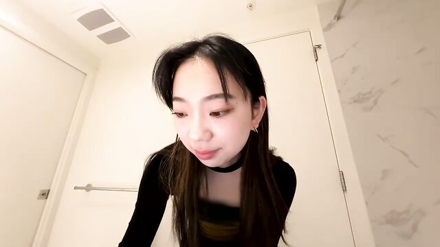 Bath time fun with a cute petite Asian girl in the tub
