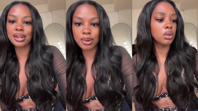 Ebony girl without a bra in a transparent shirt