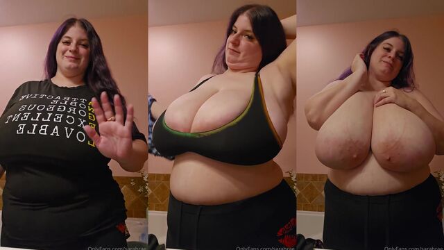 Trying to take off her blouse