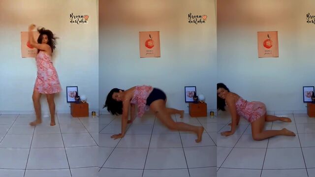 Hot brunette woman removing her shorts in a sensual dance