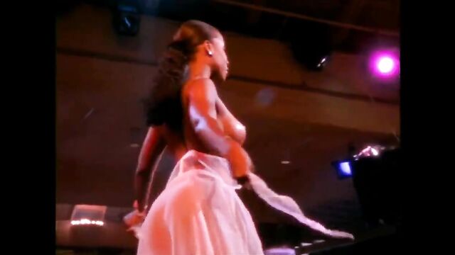 A group of sexy black women are dancing naked on the floor