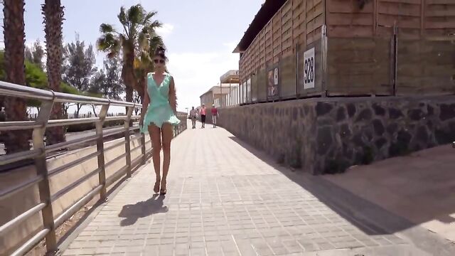 I walk in the city wearing a see-through dress