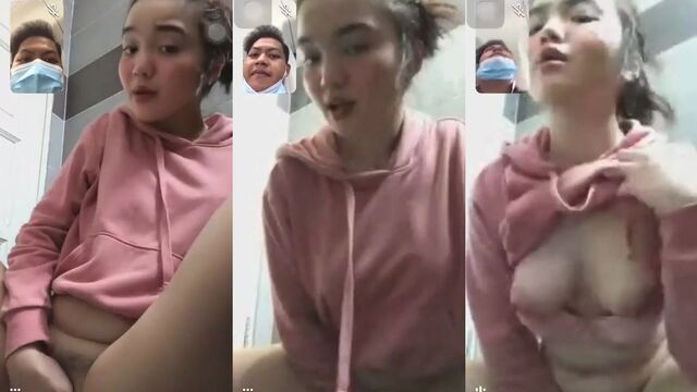 A Melayu girl is making a video call and showing her tits