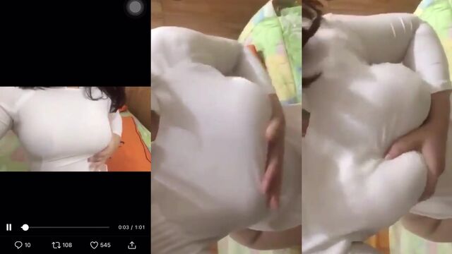 All oiled up video with a sensual touch of AO Dai