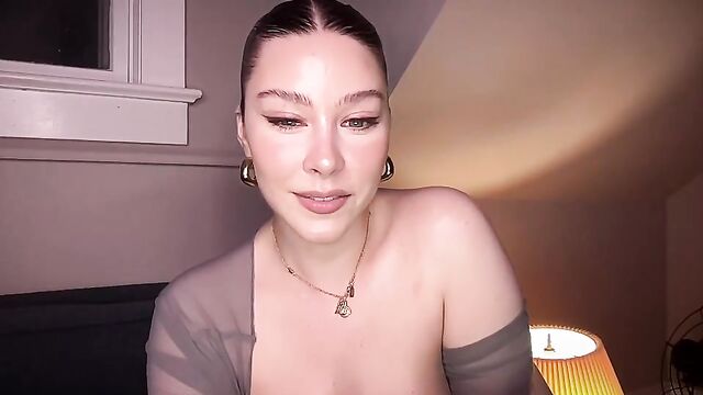 A beautiful model with huge boobs playing with her tits