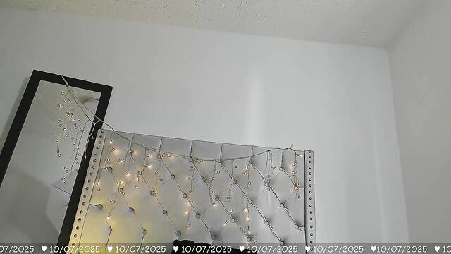 A busty cam girl gets out of her clothes and plays with her huge boobs
