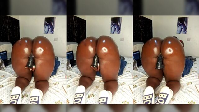 A girl with a big ass is fucking with a huge dildo