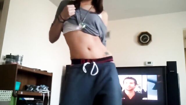 A hot chick is dancing alone in her room