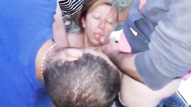 This dirty slut licks three cocks with great pleasure