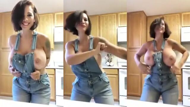 Brittany shakes her big tits in a denim overalls