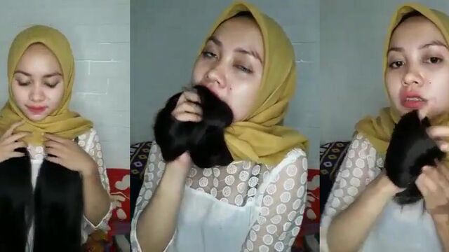 A sexy hijab-wearing Muslim woman from Indonesia gets naked and masturbates