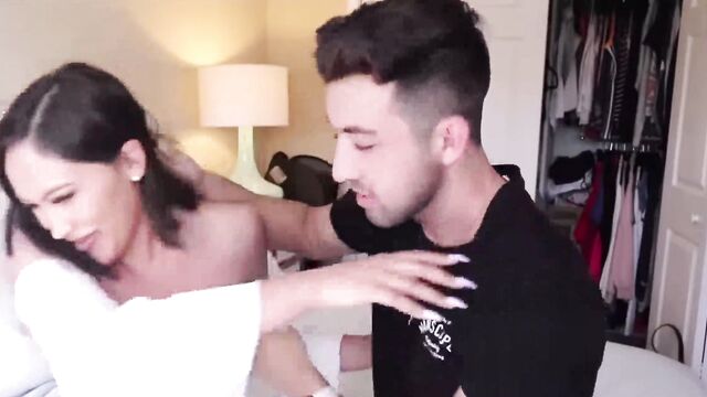 A stepbrother is kissing his sister in this hot porn video
