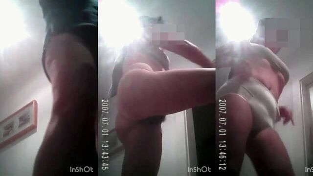 A man shooting his hot wife in sexy lingerie with a camera