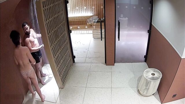 A couple has a sexual encounter in the public sauna spa