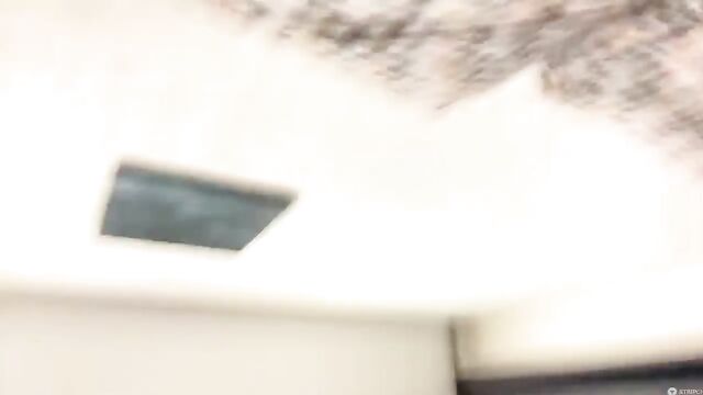 A hot cam model takes off her clothes and plays with toys