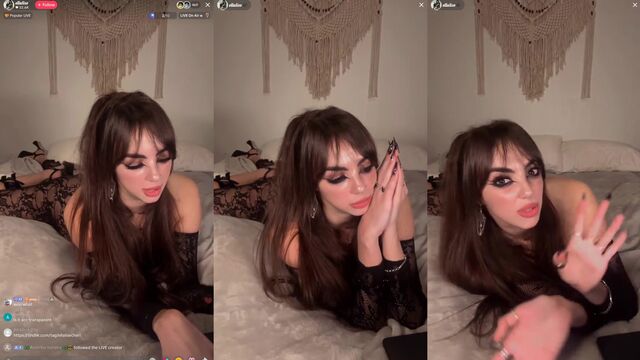 Brunette with siren eye fucks on the bed during a TikTok live stream
