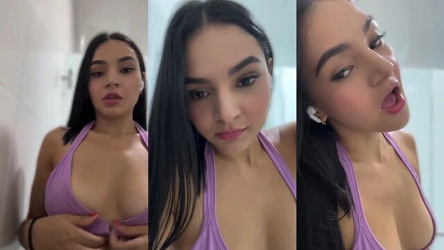 A cute girl is exercising in the gym wearing shorts