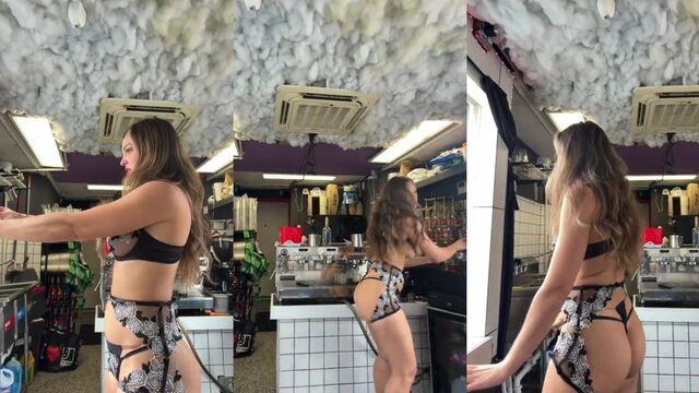 A beauty serves coffee to her customers in the coffee shop