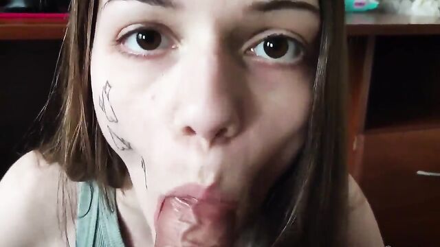 A girl blows e-cigarette smoke on the cock