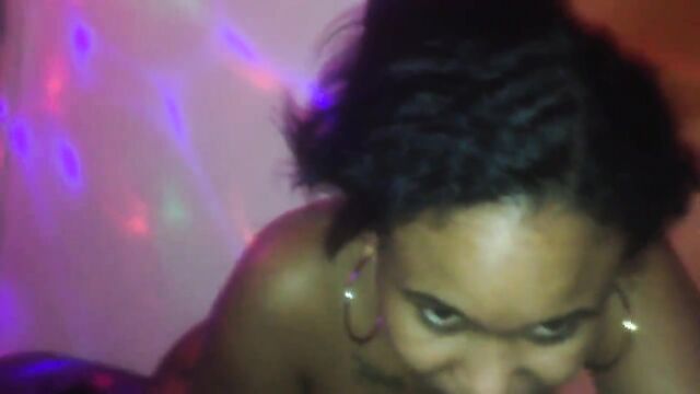 Ebony MILF with big tits moaning while sucking a big white cock