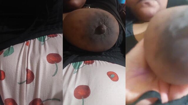 A girl with big tits is leaking milk from her breast