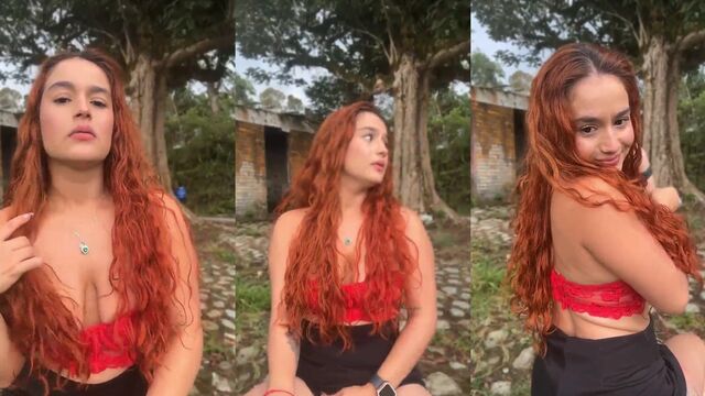 A pretty girl with fiery locks is ready to get wet and wild