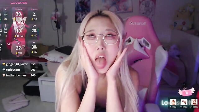 A cute petite Asian girl is playing a thrilling game with SM