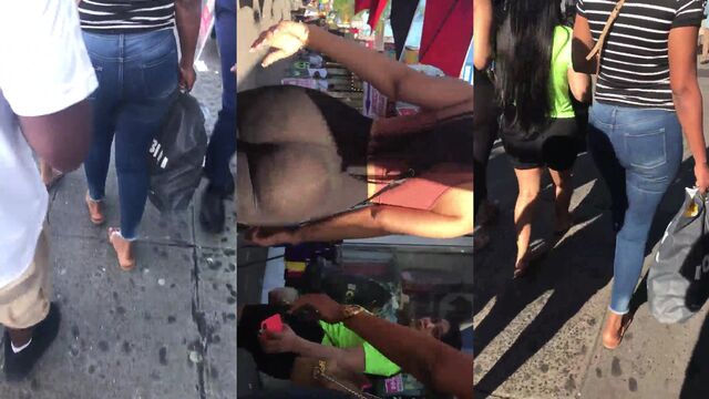 A sexy stripper is dancing on a table in a strip club