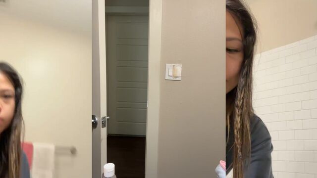 Cute petite Asian girl doing a shower tease