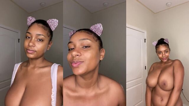 Ebony cowgirl with huge tits performs striptease and sensual dance