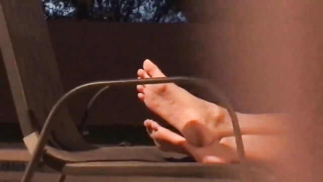 A friend's sister is teasing with her feet in a naughty way