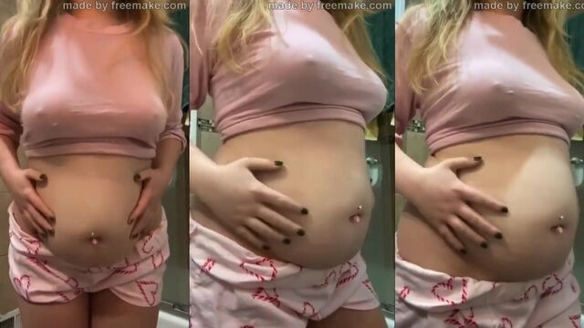 A fat blonde plays with her belly while her boyfriend slaps it