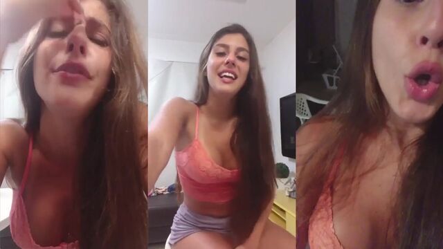 A sexy brunette doing a daring live show