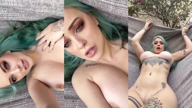 Blue-haired girl plays with a dildo and shows her holes in a sensual video